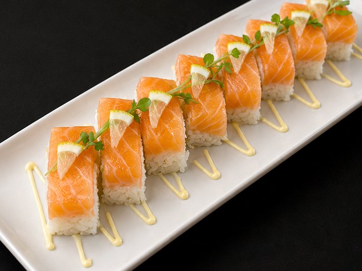 Pressed salmon lemon sushi with micro greens and lemon aioli